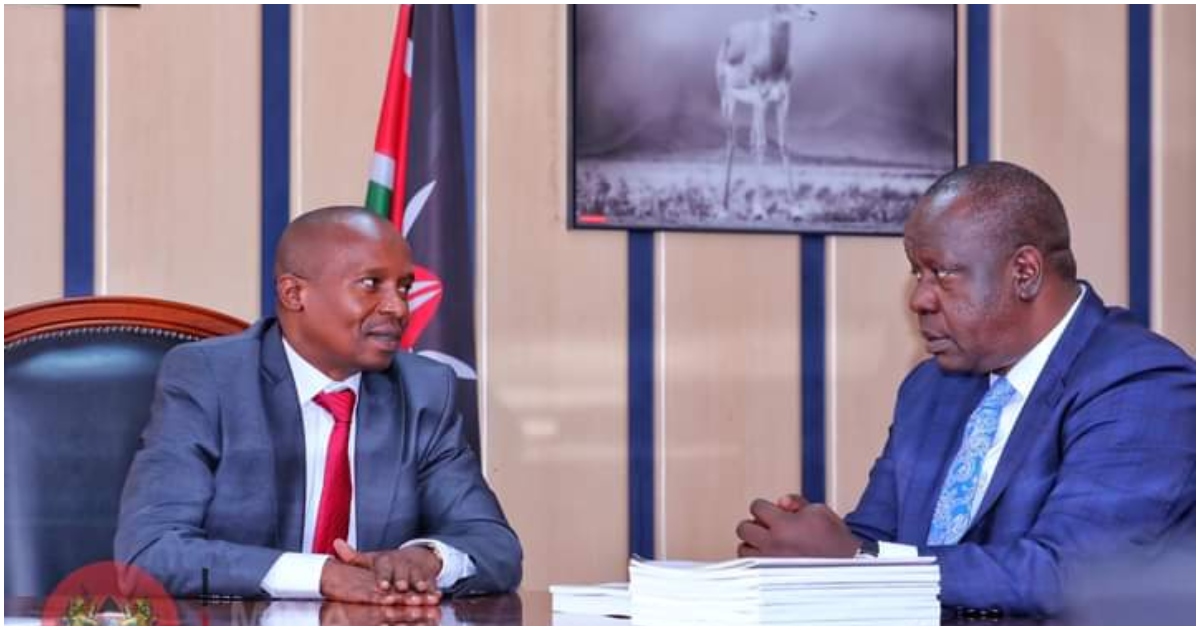 Former Interior CS Fred Matiang'i having a word with his successor Kithure Kindiki.